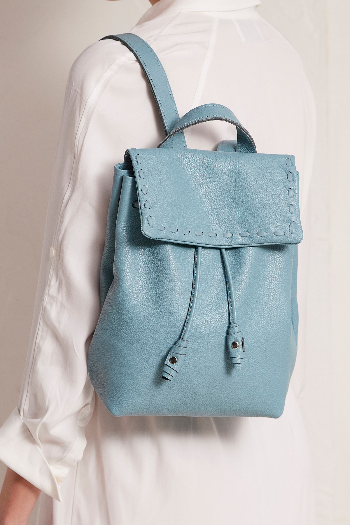 blue leather backpack purse