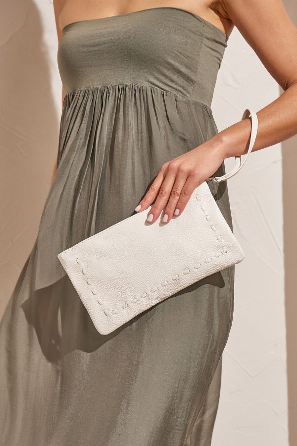 white leather clutch with strap